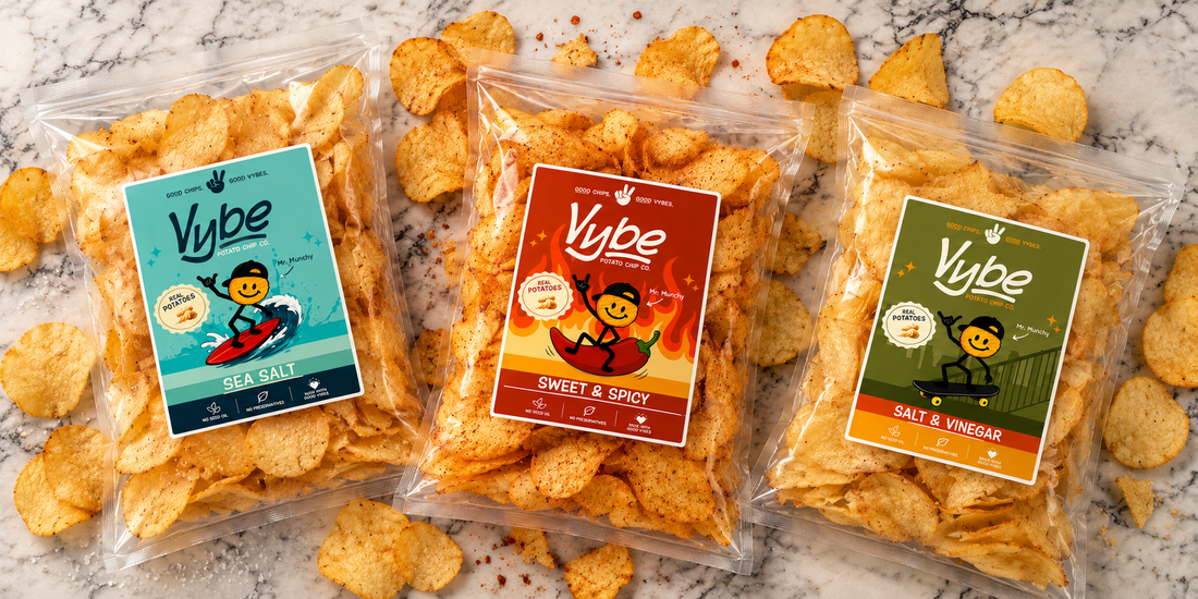 Vybe Sea Salt, Sweet & Spicy and Salt & Vinegar potato chip bags on marble